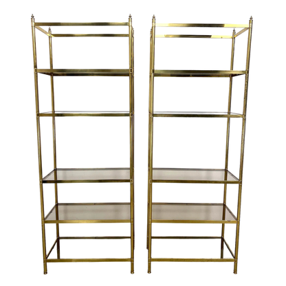 PAIR OF BILLY BALDWIN STYLE BRASS ETAGERES WITH SMOKED GLASS SHELVES