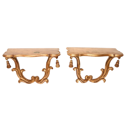 PAIR OF ROCOCO STYLE GILTWOOD WALL CONSOLES WITH TASSEL DETAIL