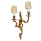 PAIR OF ROCOCO GILT BRONZE TWO ARM WALL SCONCES