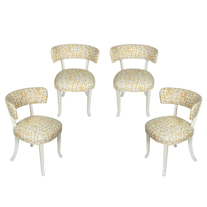 SET OF FOUR WHITE PAINTED KLISMOS CHAIRS WITH YELLOW LES TOUCHES FABRIC