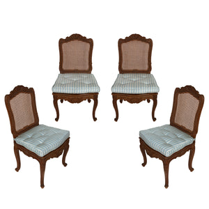 SET OF FOUR CARVED FRENCH CHAIRS WITH CANE BACK AND BLUE SILK STRIPE CUSHIONS