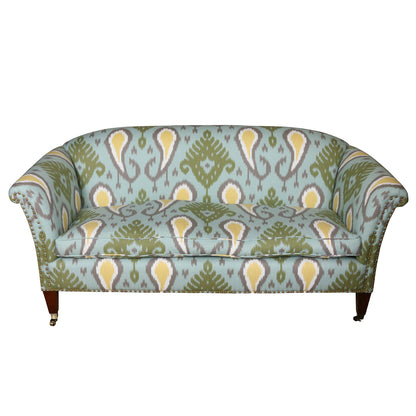 VINTAGE ENGLISH ROLL ARM UPHOLSTERED SETTEE IN BLUE & GREEN IKAT WITH NAILHEAD TRIM