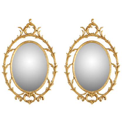 PAIR OF OVAL GILTWOOD MIRRORS WITH SCROLL MOTIF