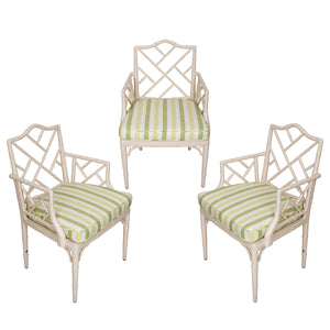 SET OF THREE WHITE PAINTED BAMBOO CHAIRS WITH GREEN STRIPED FABRIC SEATS