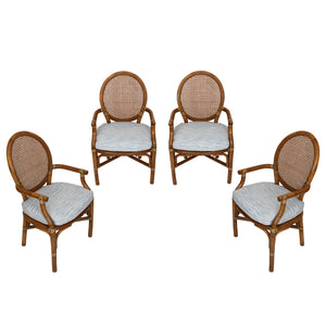 SET OF FOUR MCGUIRE STYLE RATTAN ARM CHAIRS WITH JOHN ROBSHAW CUSTOM BLUE CUSHIONS