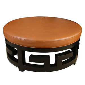 ROUND PEBBLED LEATHER OTTOMAN WITH BLACK FRETWORK BASE