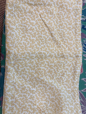 YELLOW AND WHITE LUMBAR PILLOW