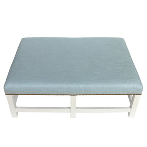 PIERRE FREY BLUE UPHOLSTERED OTTOMAN WITH NAILHEAD DETAIL