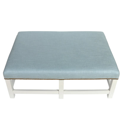 PIERRE FREY BLUE UPHOLSTERED OTTOMAN WITH NAILHEAD DETAIL