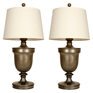 A PAIR OF ANTIQUED SILVER LARGE URN LAMPS