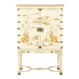 DESSIN FOURNIR WHITE LACQUERED CABINET WITH BRASS HARDWARE AND GOLD ASIAN DETAIL