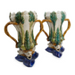 PAIR OF PALM MOTIF MAJOLICA GLAZED VASES WITH DOLPHIN BASE