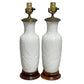 PAIR OF WHITE PORCELAIN TABLE LAMPS IN PALM LEAF RELIEF