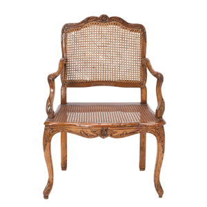 ANTIQUE LOUIS XV STYLE CARVED WALNUT AND CANE FAUTEUIL