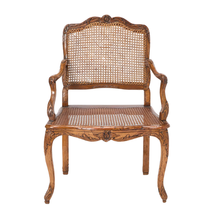 ANTIQUE LOUIS XV STYLE CARVED WALNUT AND CANE FAUTEUIL