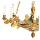EMPIRE STYLE GILT AND PATINATED METAL EIGHT LIGHT CHANDELIER WITH BIRD MOTIF