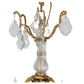 LOUIS XV STYLE TWELVE ARM BRASS AND FACETED CRYSTAL CHANDELIER