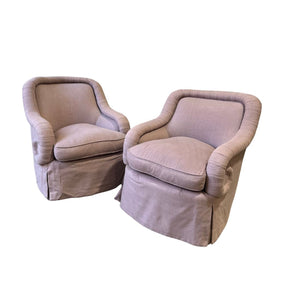 PAIR OF ROLL ARM SWIVEL CHAIRS FULLY UPHOLSTERED IN PINK LINEN