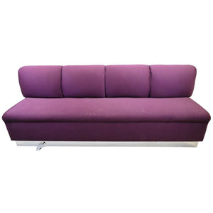 UPHOLSTERED AUBERGINE BANQUETTE WITH CHROME DETAIL