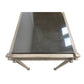 PAIR OF SILVERED IRON CONSOLE TABLES WITH BLACK GRANITE TOP