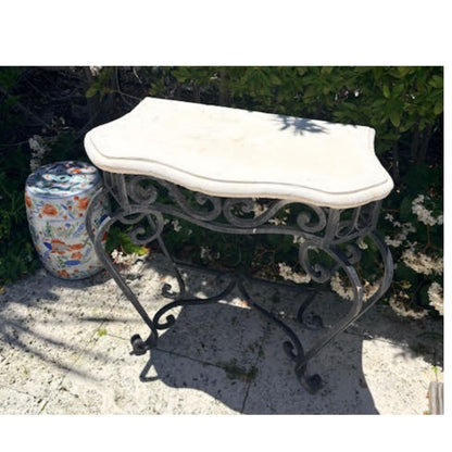 A PAIR OF IRON CONSOLES WITH STONE TOP