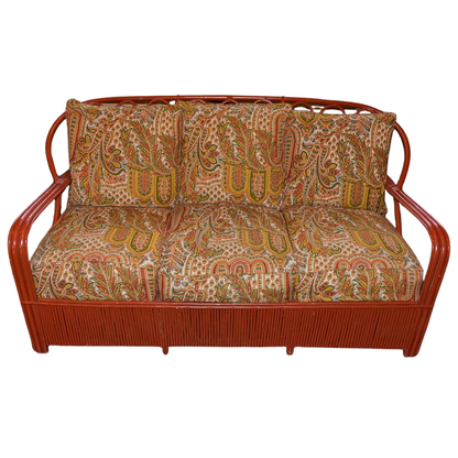 MID CENTURY RED PAINTED RATTAN SOFA WITH PAISLEY UPHOLSTERY