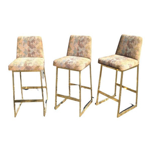 SET OF THREE MID CENTURY MODERN GOLD TONE UPHOLSTERED BARSTOOLS