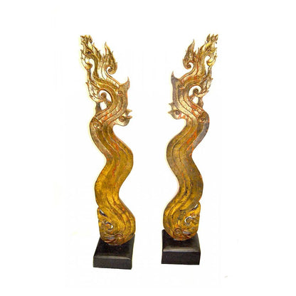 PAIR OF GILT WOOD ASIAN NAGA SCULPTURES ON EBONIZED BASES